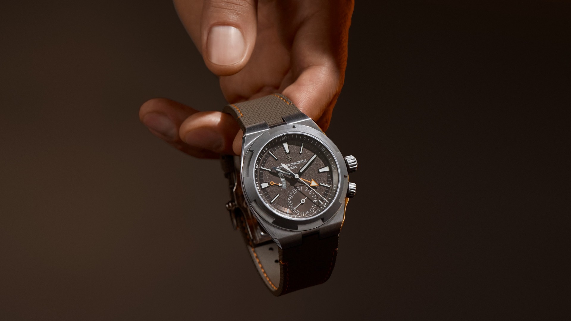Overseas dual time cardinal points with a brown strap, a stainless steel bezel, and a brown case.