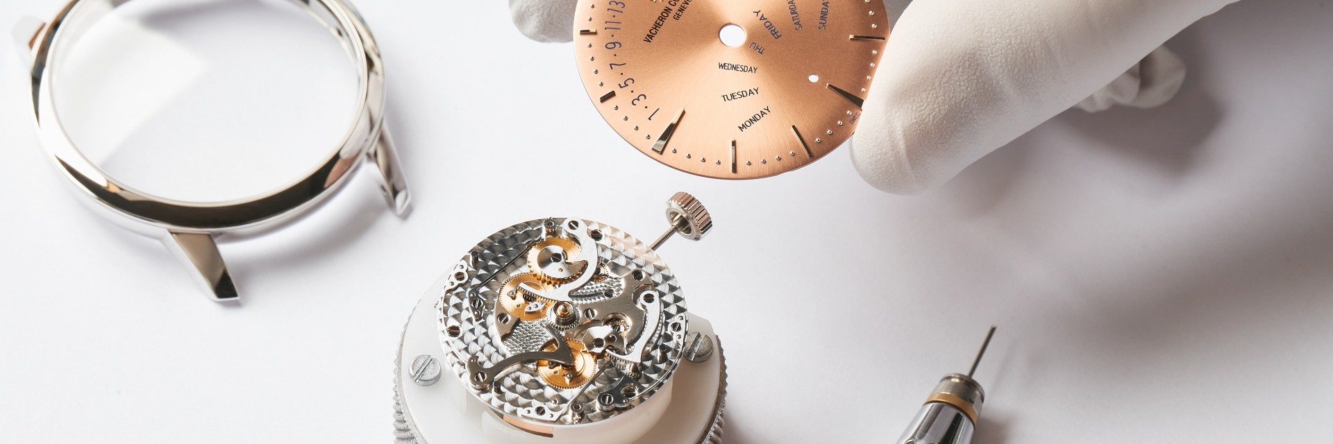 Watchmaker assembling watch parts
