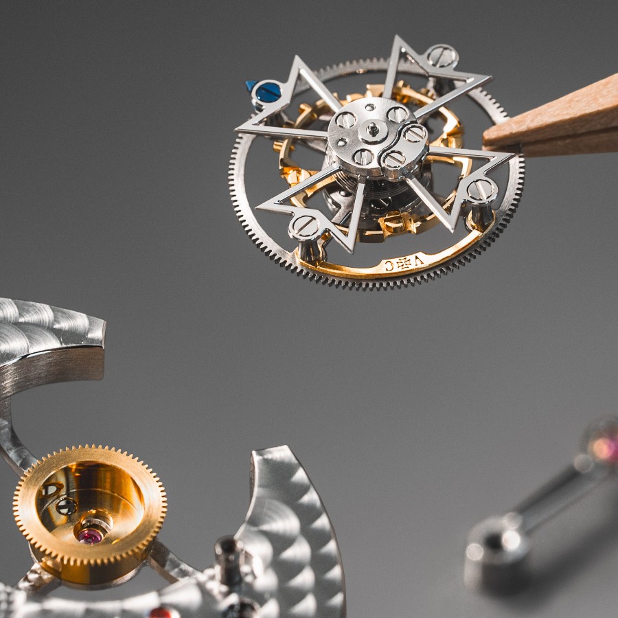 Close-up of a finely crafted watch component with intricate details and visible gears.