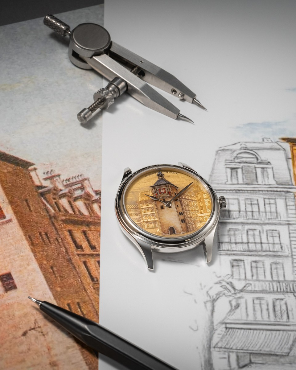  Watch with a painted city tower dial placed over architectural sketches and drawing tools.