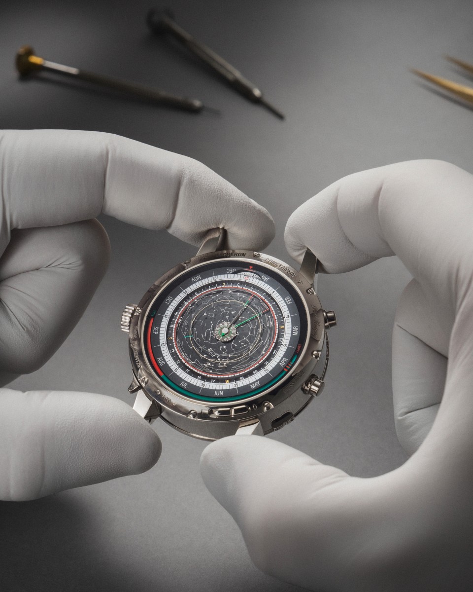 Hands holding the head of a powerful watch