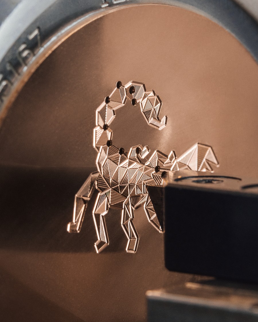 Close-up of a Scorpion guillochage work