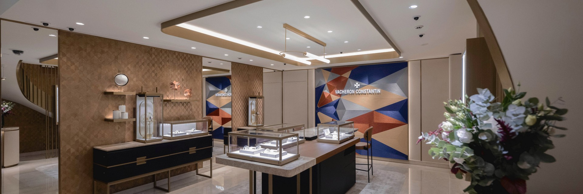 Luxury Vacheron Constantin boutique interior with display cases and modern décor.