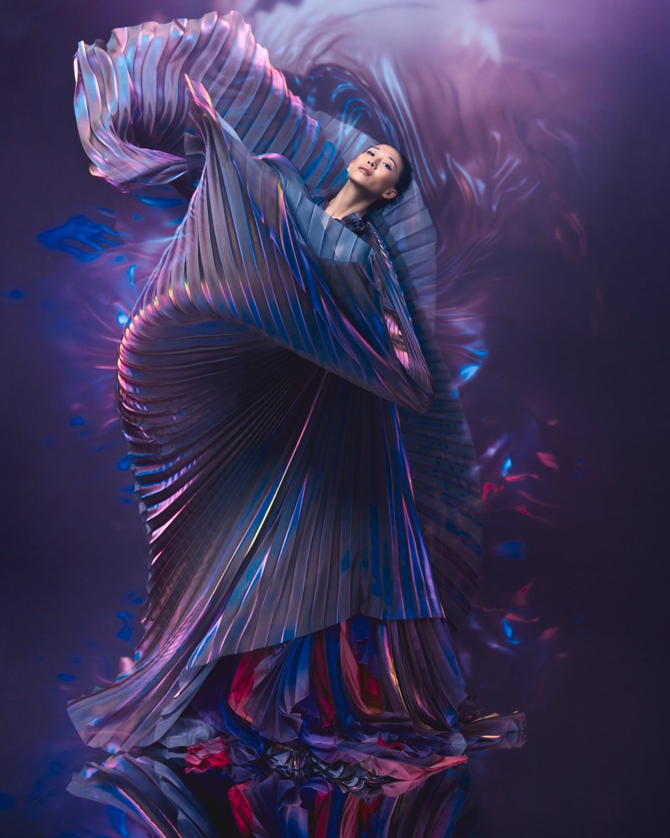 Yiqing Yin works in a  beautiful purple dress