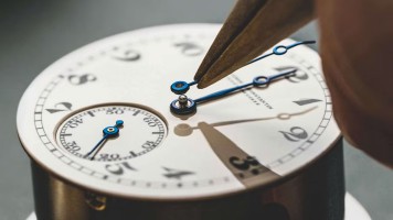 Carefully adding hands to a reborn American 1921 watch