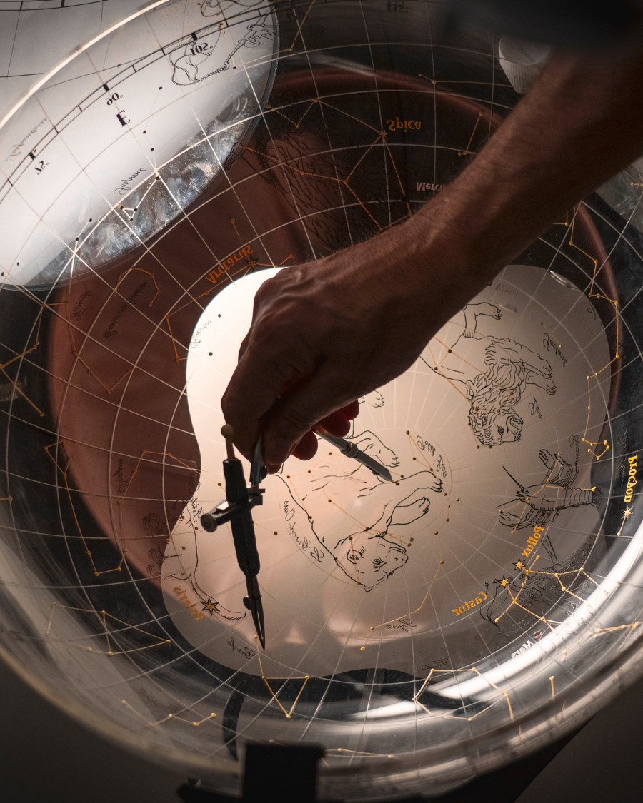 Image illustarting a compass on a transparent world map 
