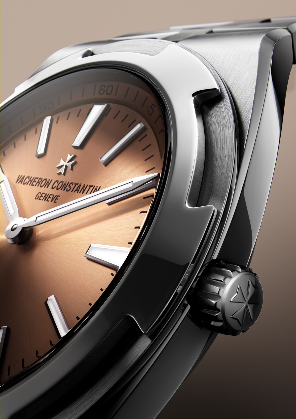 Macro close-up of a luxury stainless steel wristwatch case, crown, and textured dial.